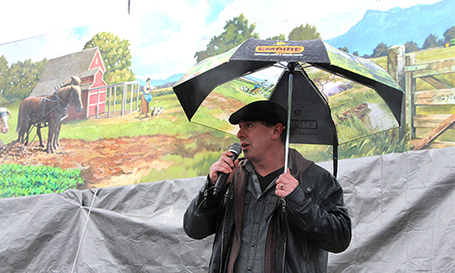 Artist Dean Lauze discusses the 160-foot mural he created for Empire Abbotsford on Friday during an unveiling celebration. (Vikki Hopes/Abbotsford News)