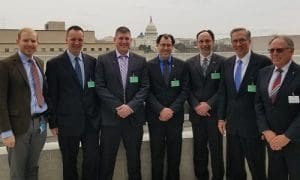 Left to right: Brad Wood, first secretary (Commerce) Embassy of Canada, Wally Dingman, Dalbert Livingstone, David Gold, Steve Fletcher, Michael Wilson, Ed MacDonald